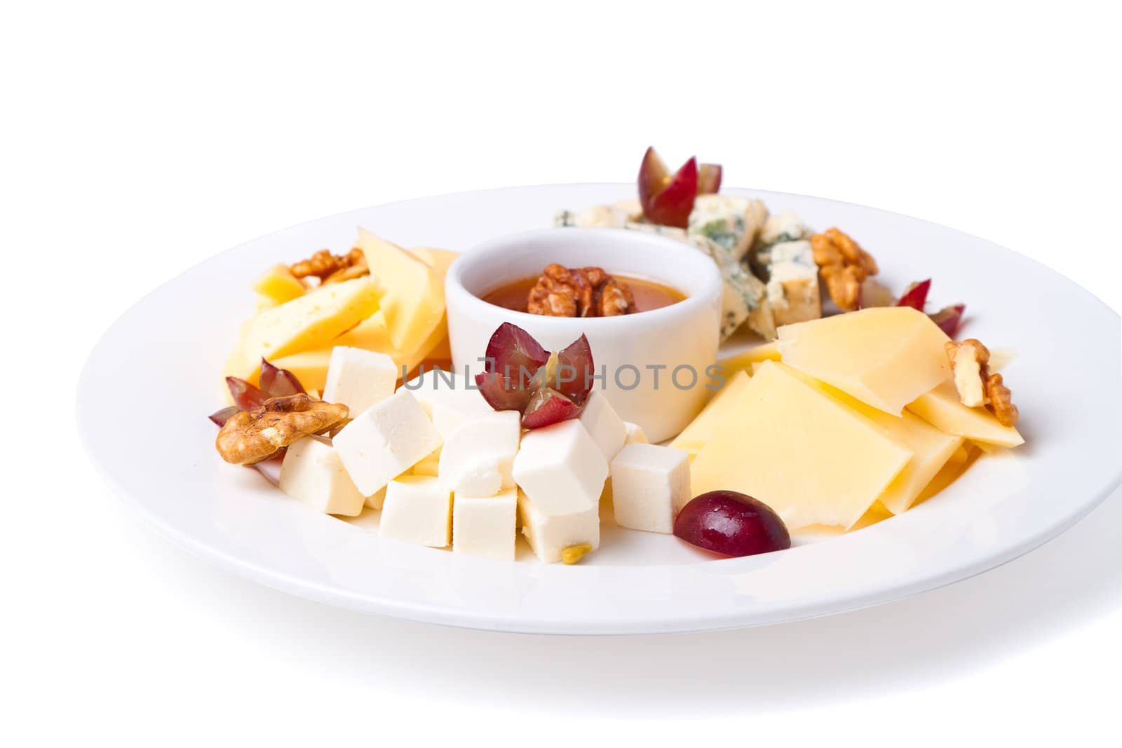 a plate with slices of cheese of different varieties by Pogost