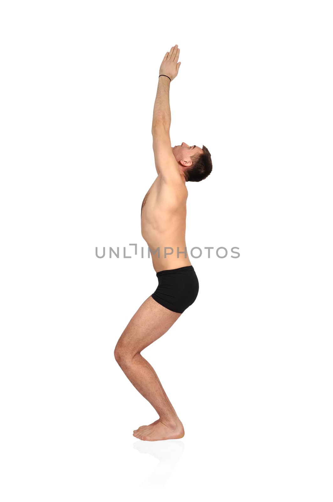 man practicing yoga in position by vetkit