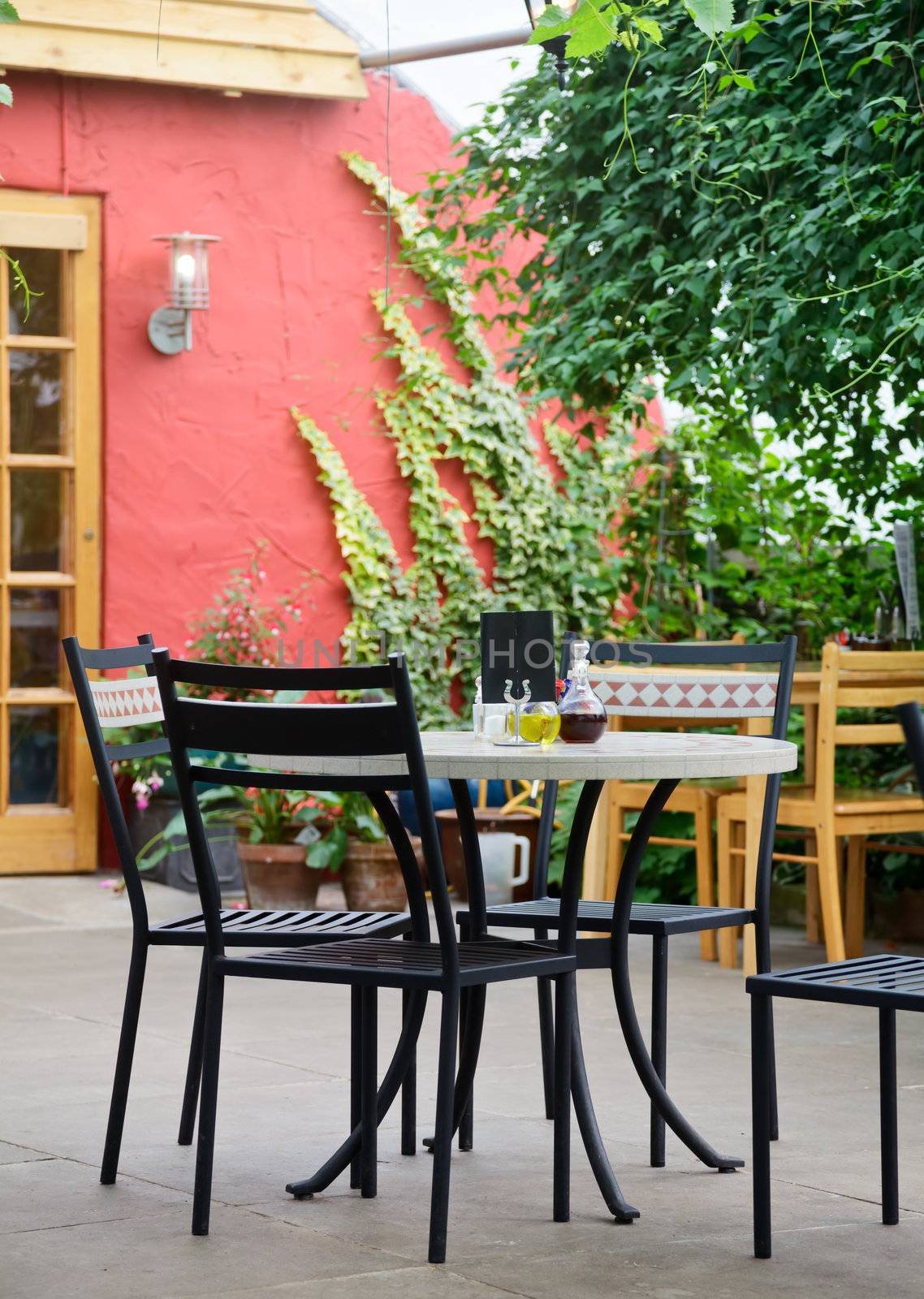 Table with chairs in a cafe terrace