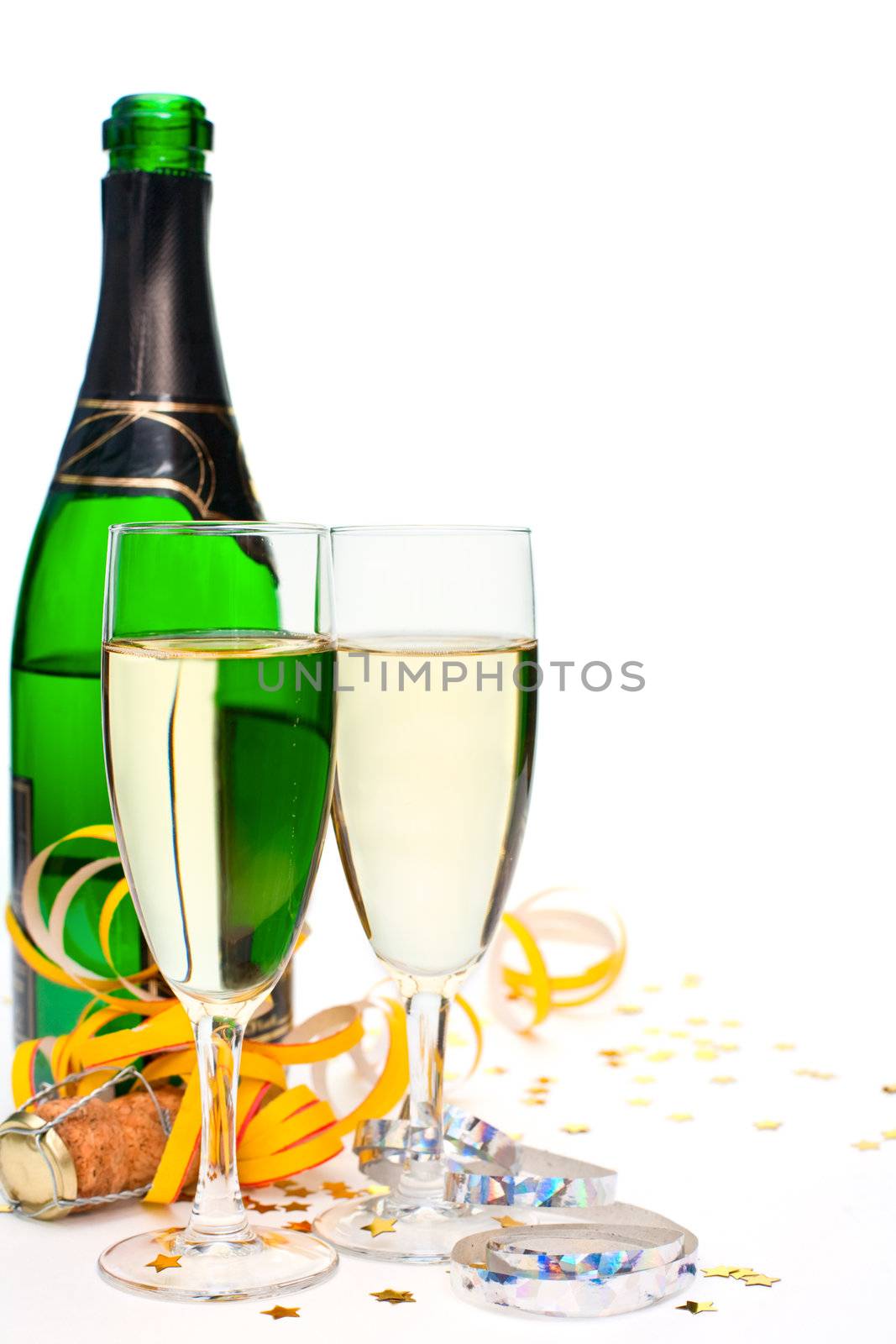 Two glasses of champagne with ribbons and confetti on white background