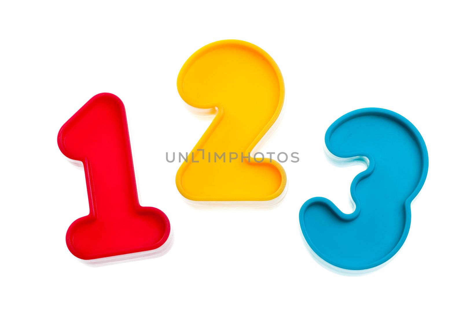 Colorful plastic numbers one two three on white background