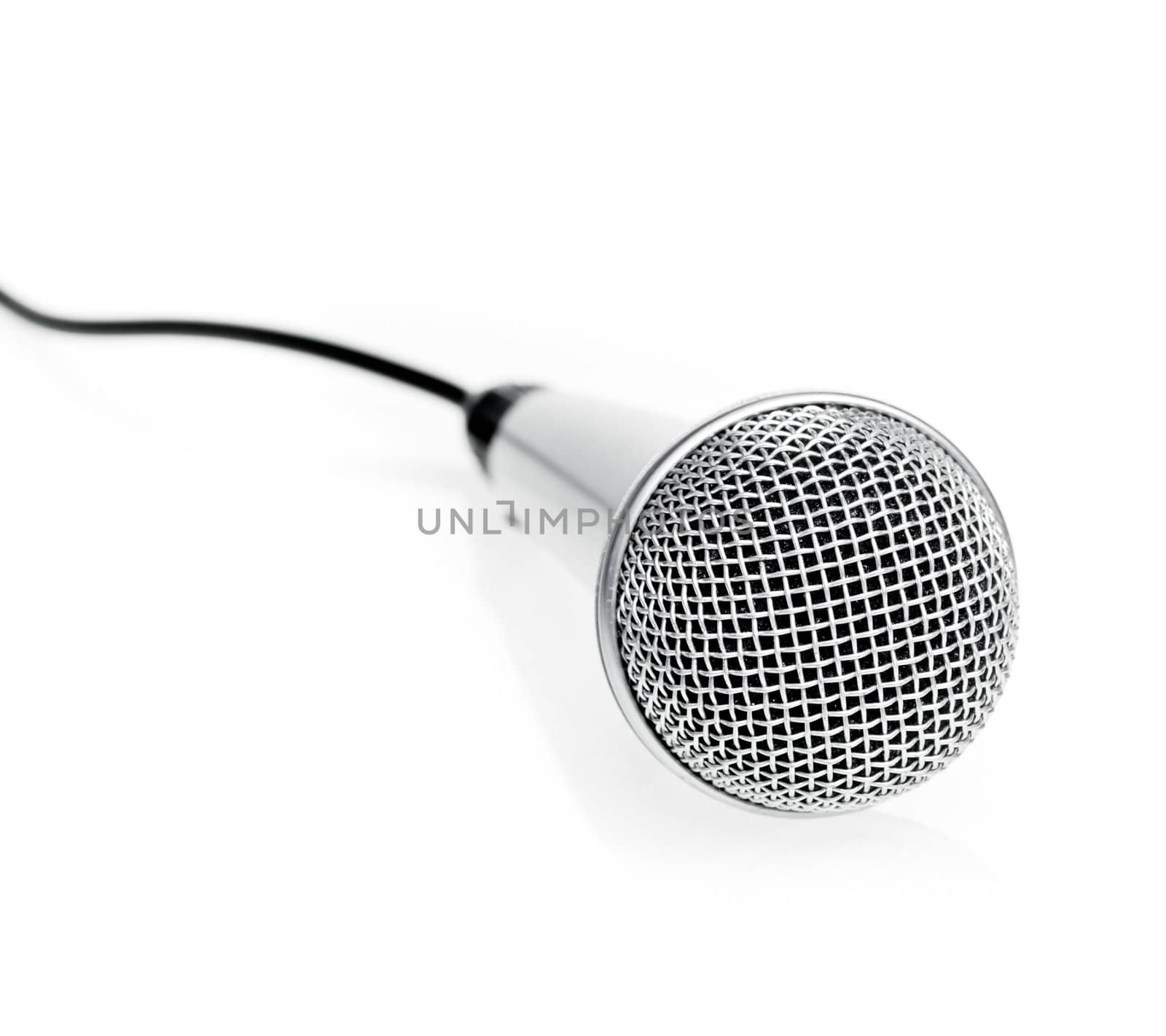 Silver microphone on white background