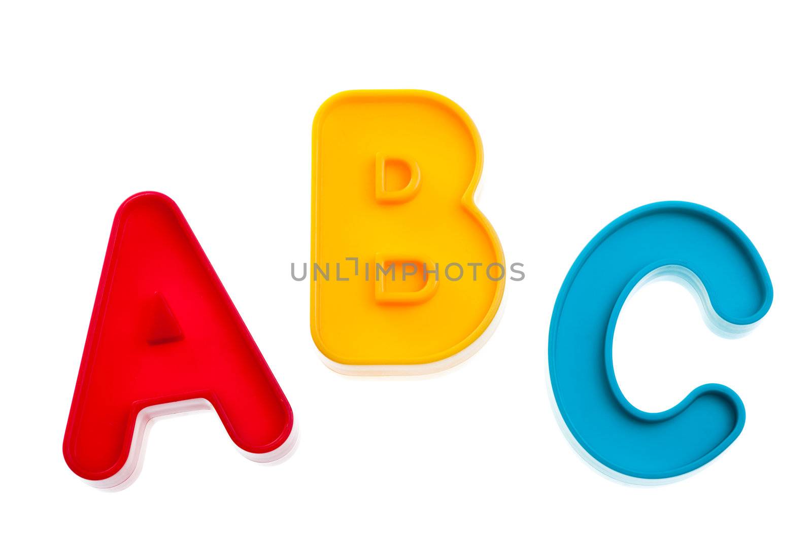 Colorful plastic letters A B C on white background
