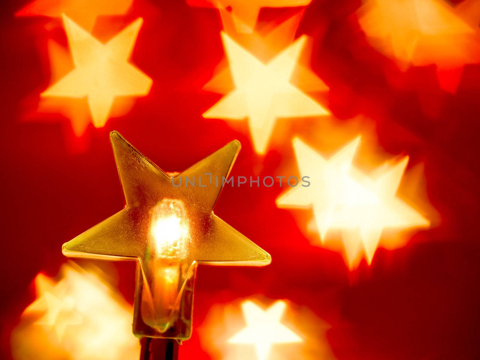 Star shaped Christmas light with blured background, very shallow DOF