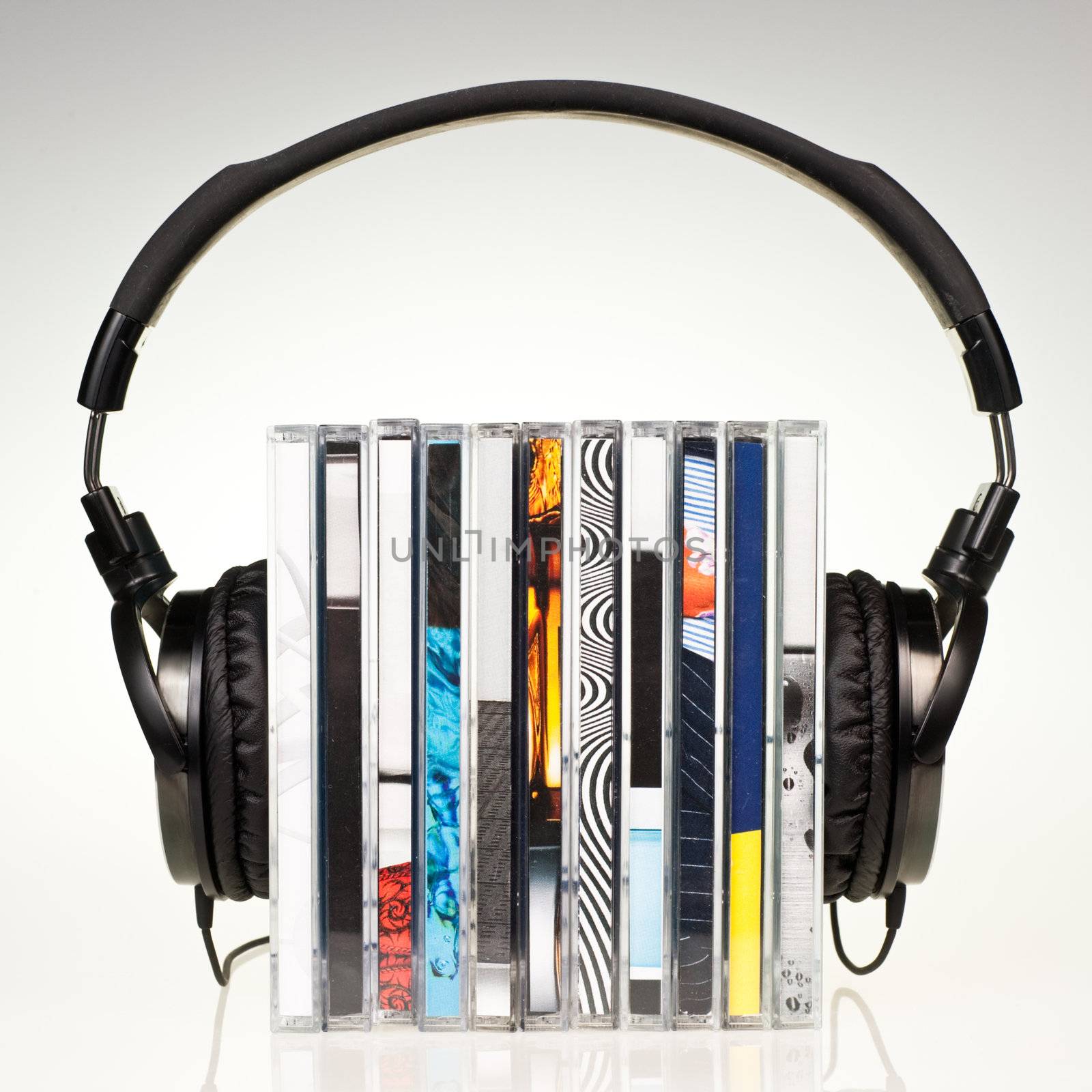 HI-Fi headphones on stack of CDs