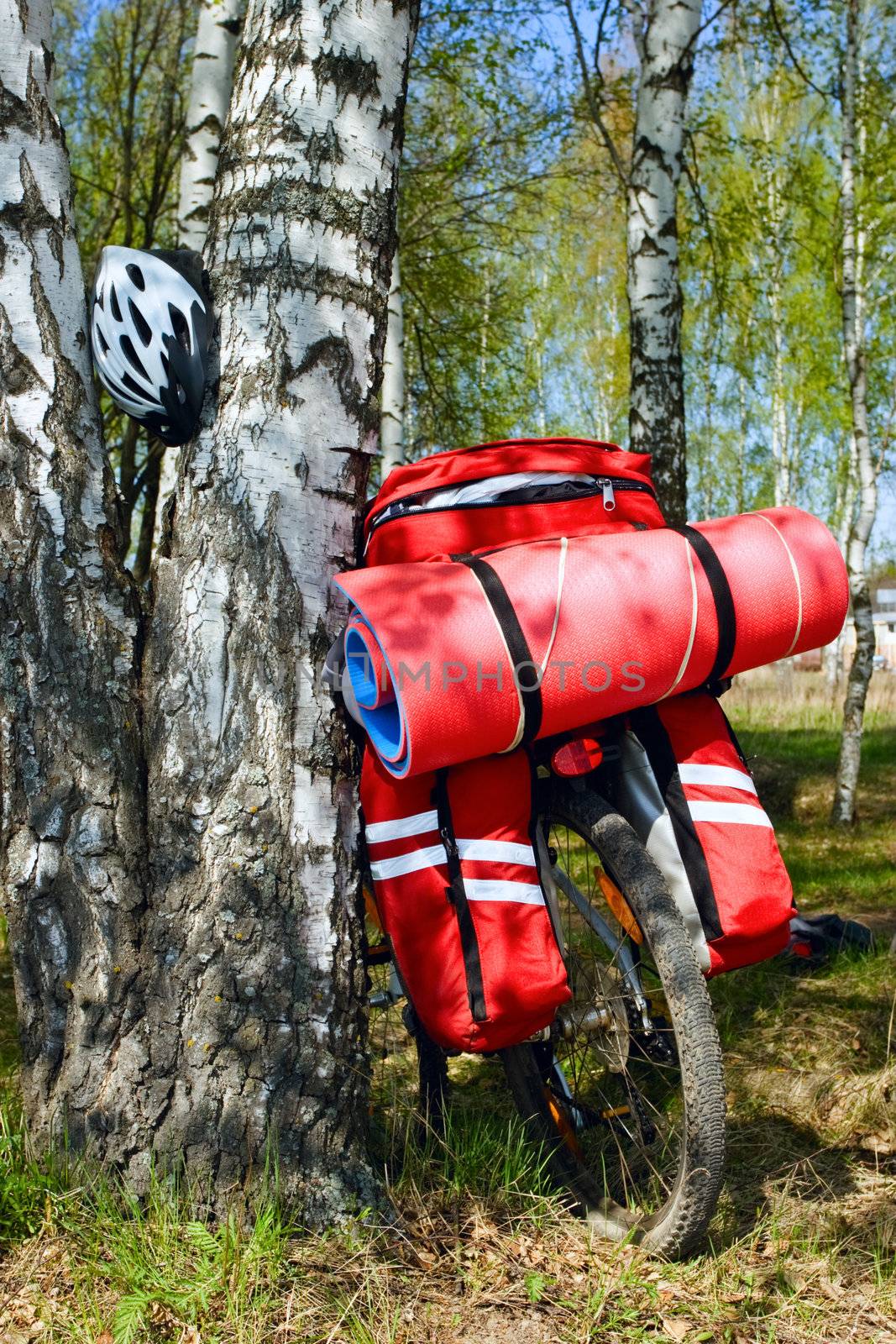 Loaded touring bicycle and helmet on rest break