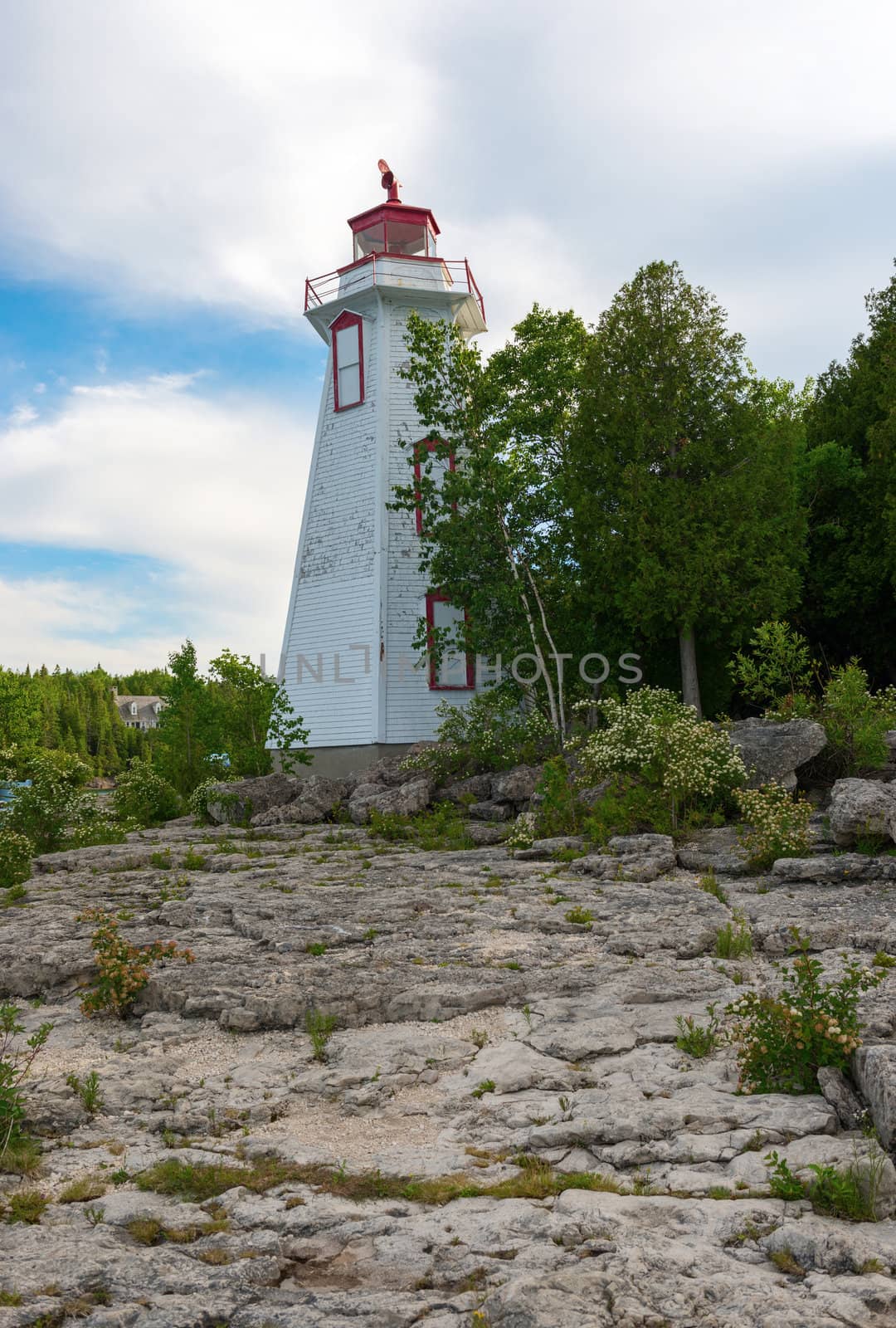 Big Tube Lighthouse in Tobermory Ontario was constructed in 1885. Played an important role guiding ships into the harbour from the waters of Lake Huron and Georgian Bay. The original structure was replaced by the six-sided, 14 meters wooden lighthouse that is seen today.