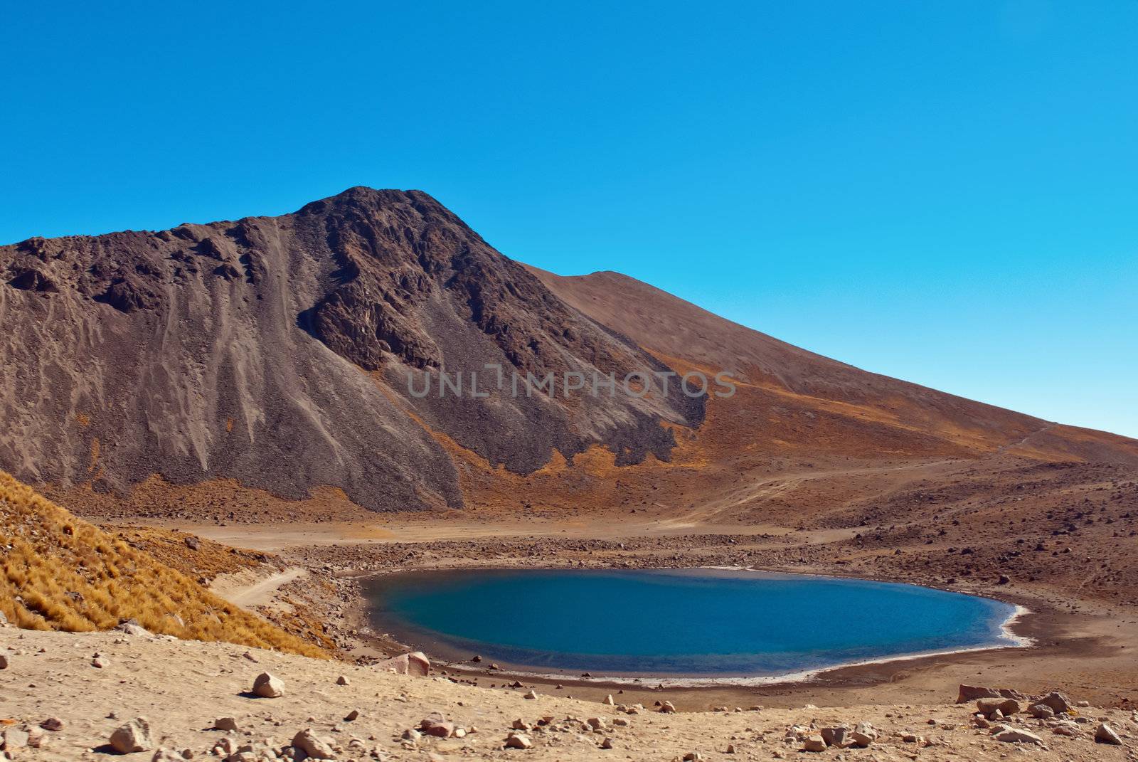 Nevado de Toluca is a large stratovolcano in central Mexico, located about 80 kilometres (50 mi) west of Mexico City near the city of Toluca. It is generally cited as the fourth highest of Mexico's peaks. There are two crater lakes on the floor of the basin at about 4,200 m (13,800 ft), the larger Lago del Sol (Sun Lake) and the smaller, but deeper, Lago de la Luna (Moon Lake). A road formerly ran into the caldera to the lakes, making this perhaps the most accessible major Mexican peak.