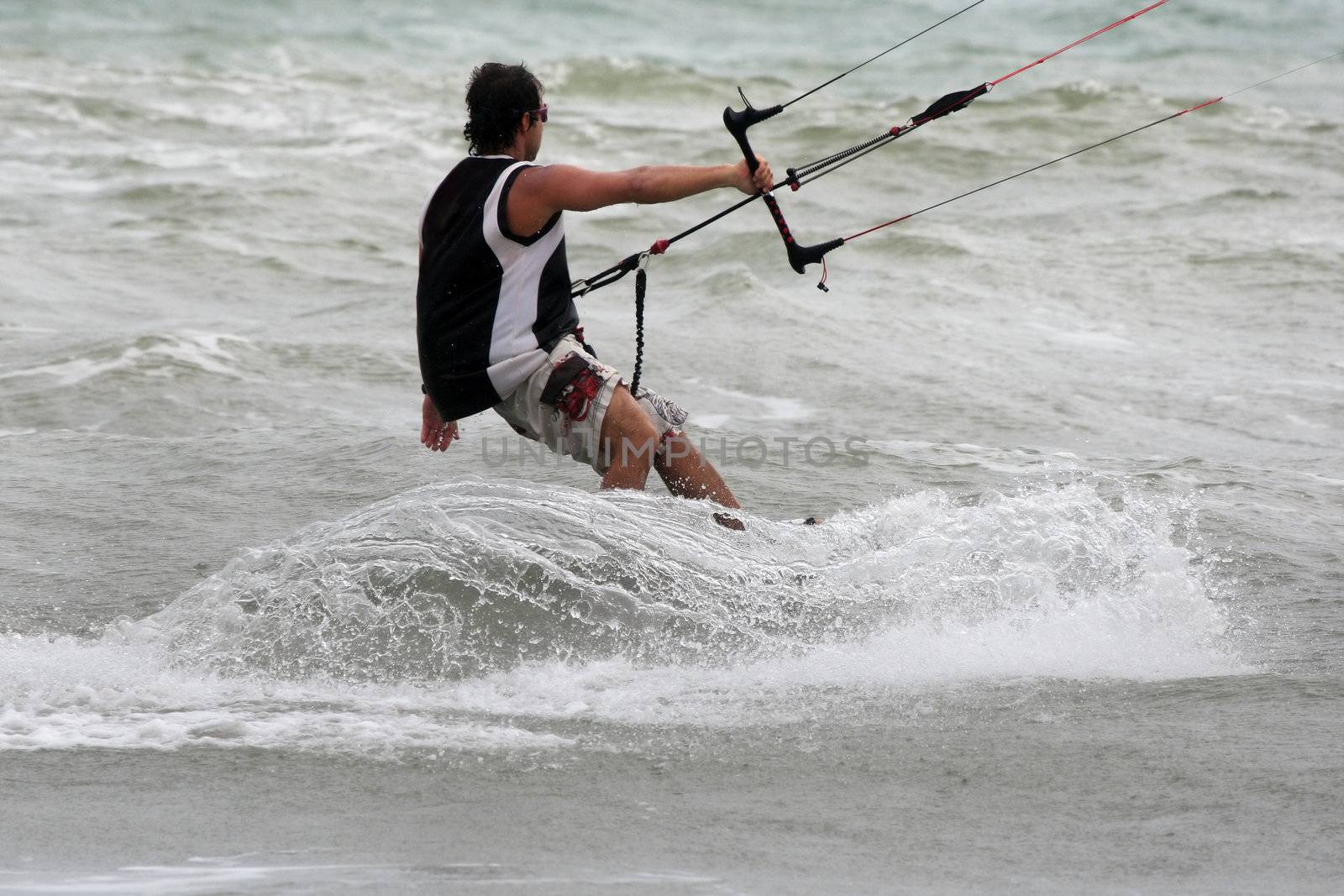 Kiteboarder enjoy surfing in water. Vietnam