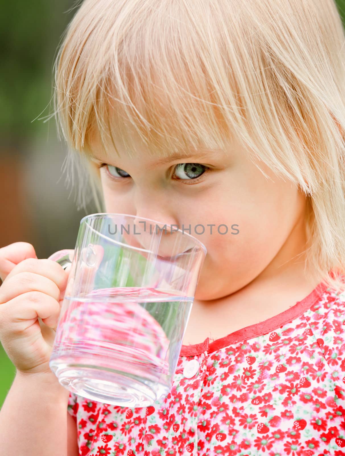 Child drinking water by naumoid