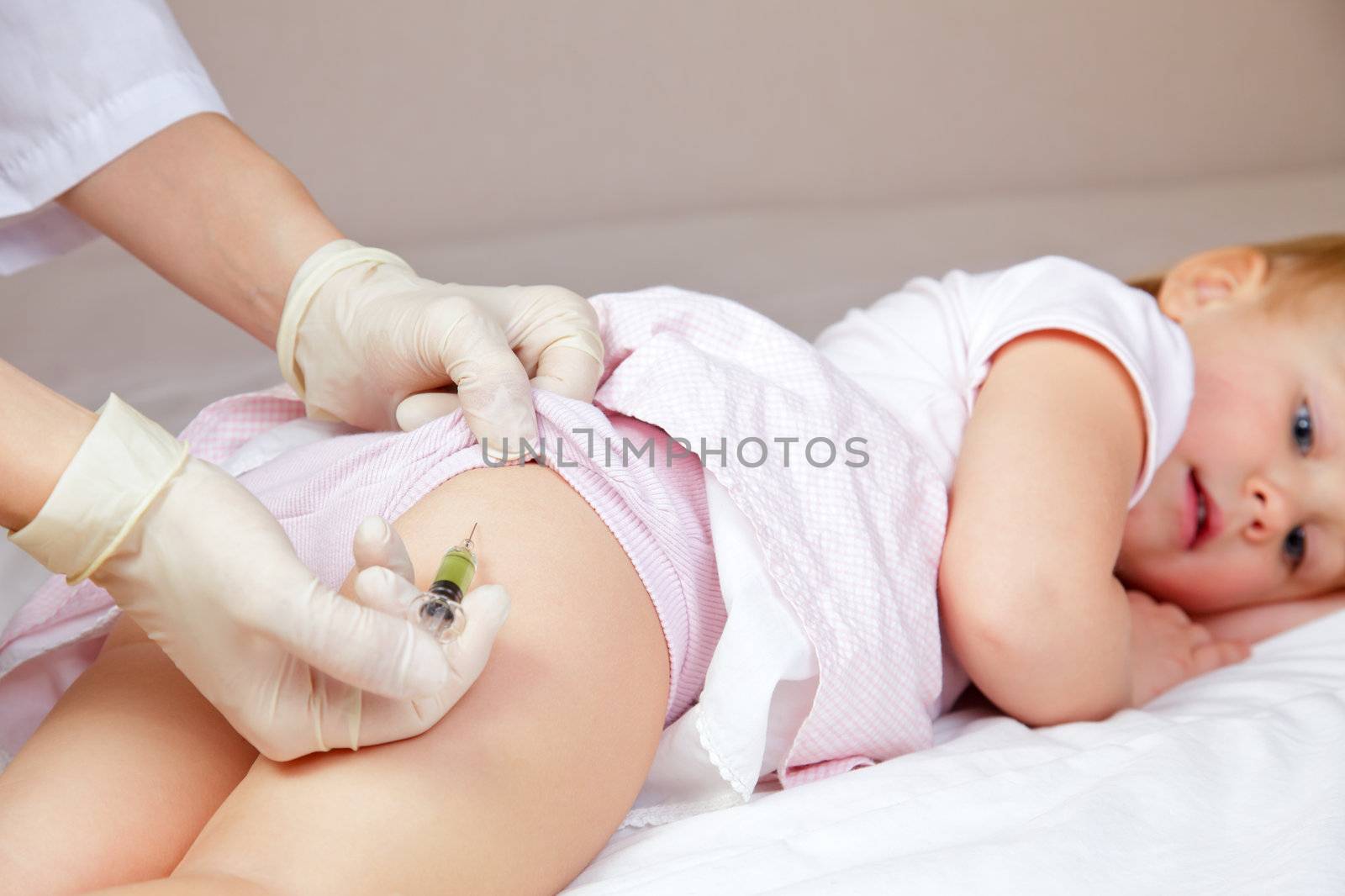 Little baby girl gets an injection by naumoid