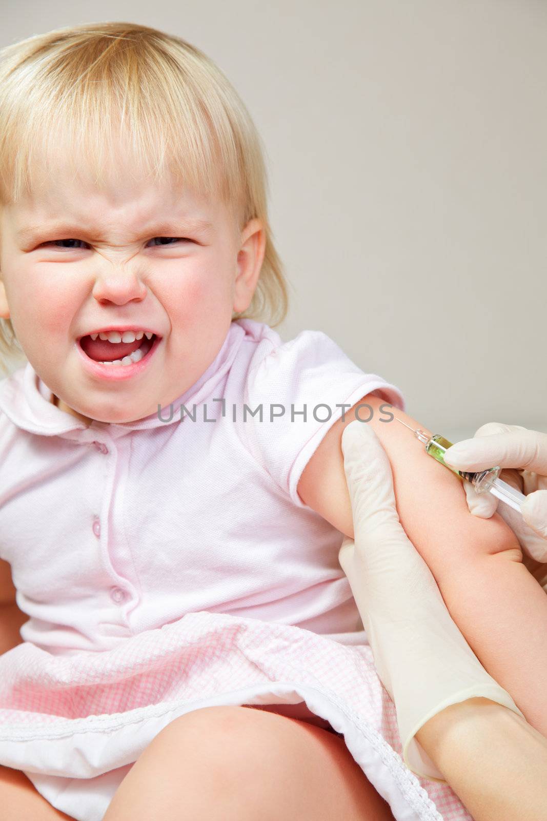 Little girl gets an injection by naumoid