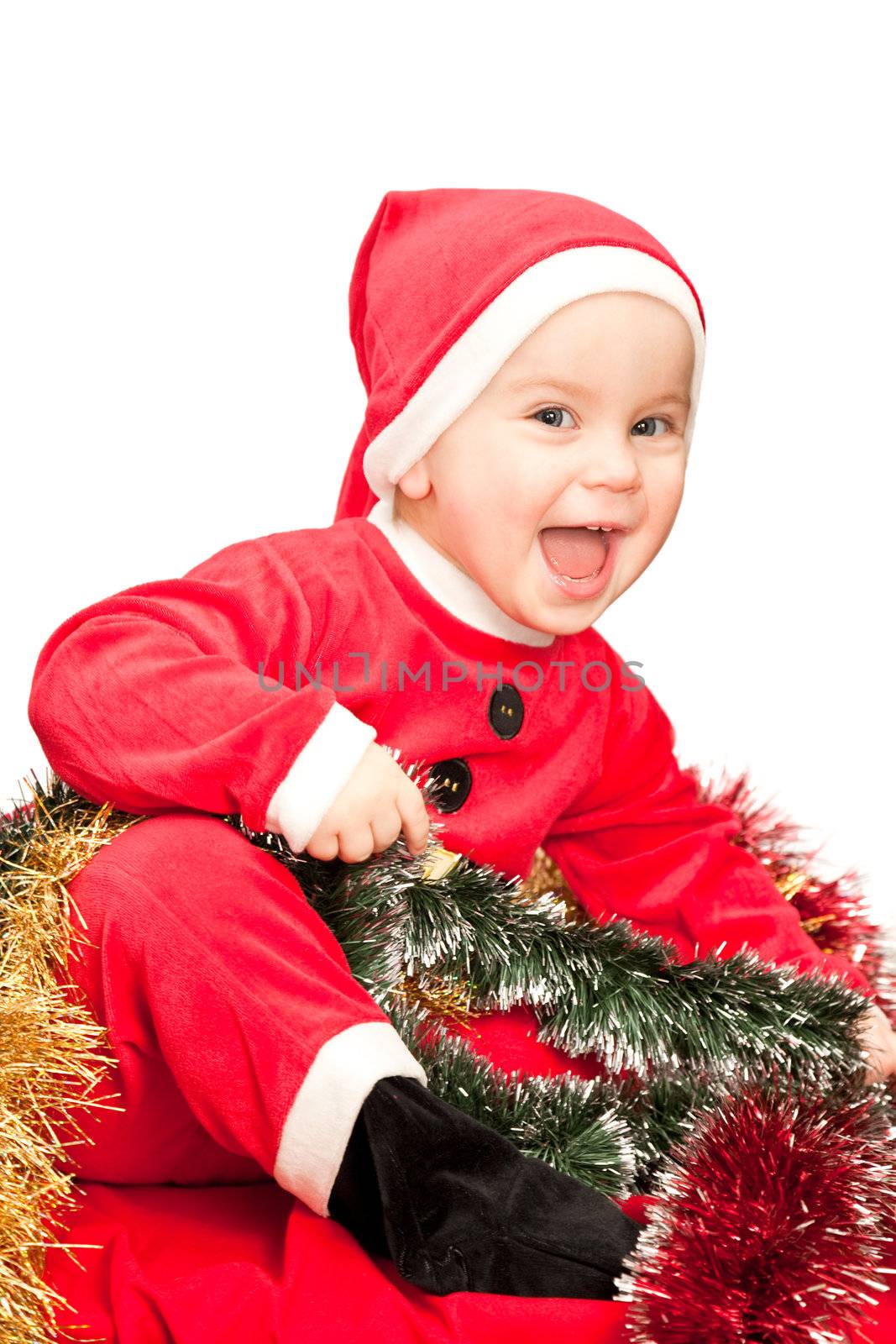 Little baby girl wearing Santa Claus costume on white background
