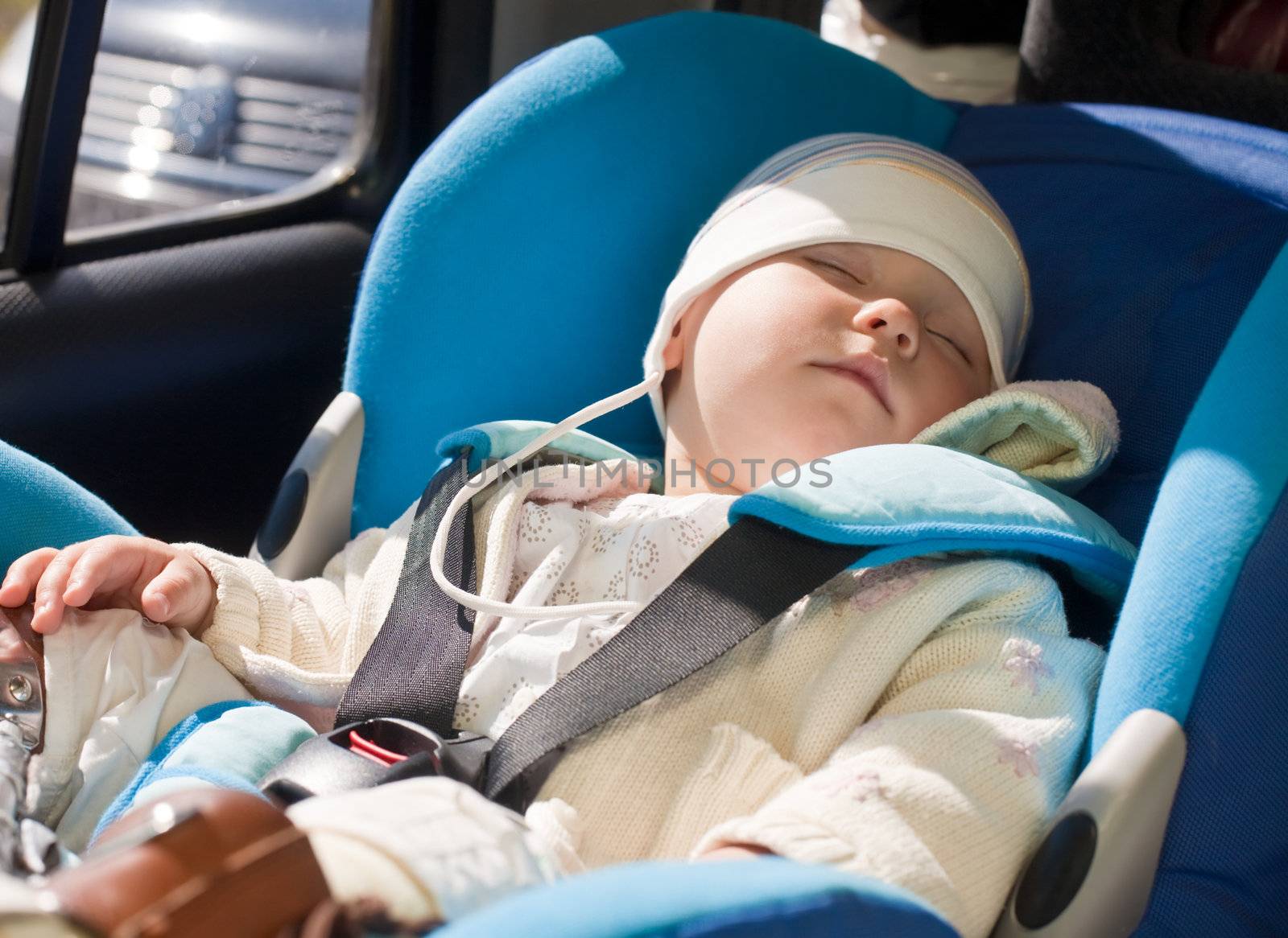 Toddler in a car seat by naumoid