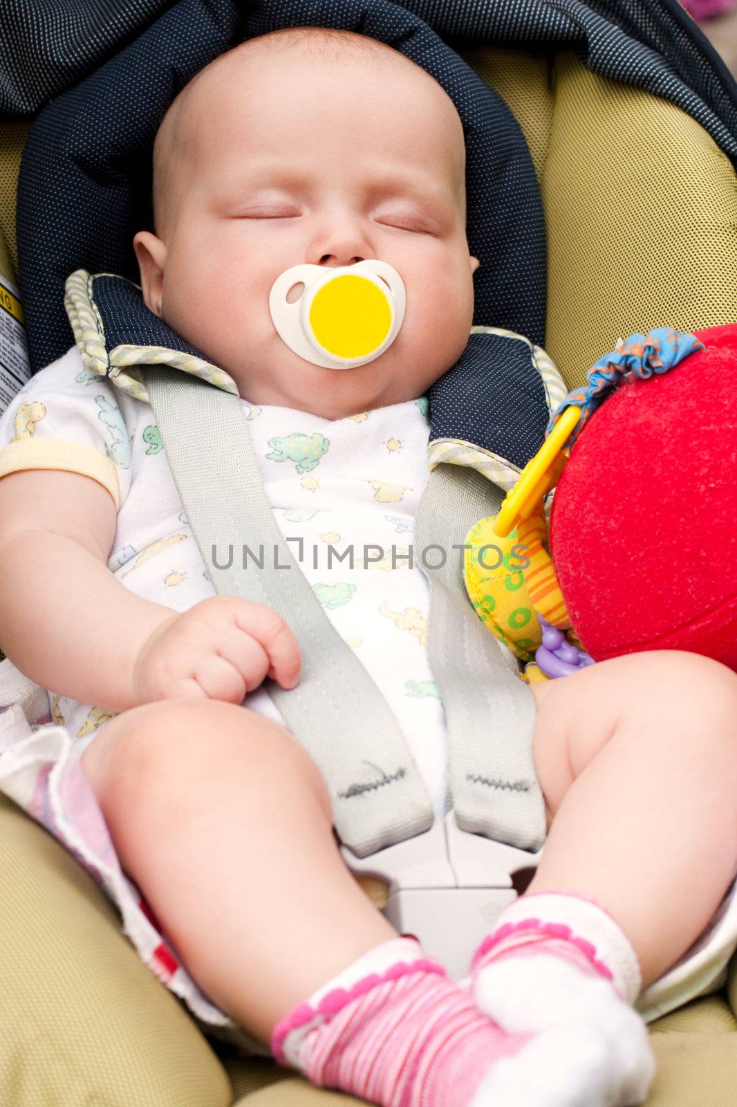 Four month infant sleeping in a car seat