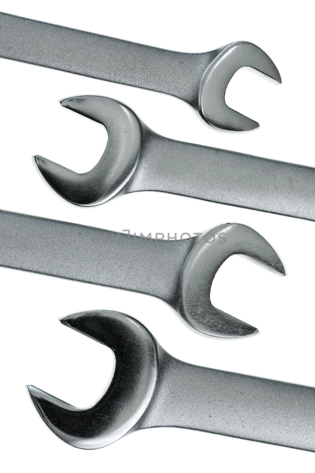 Set of chrome lug wrenches on white background