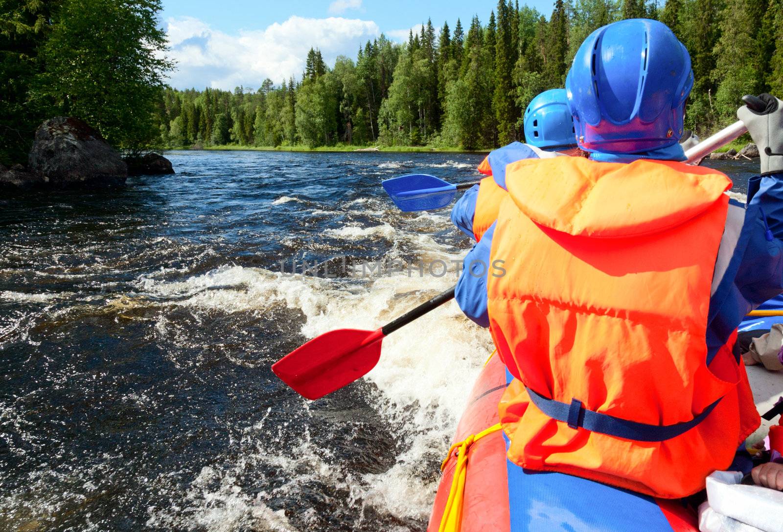 Rafters in a rafting boat on Pistojoki river in Karelia, Russia