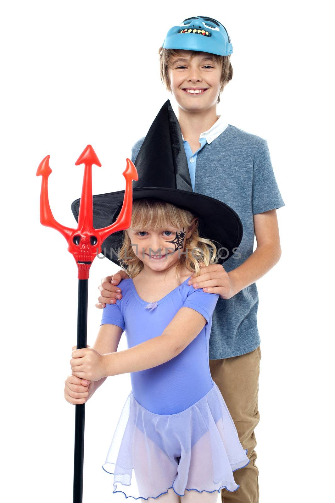 Boy and girl wearing halloween costume by stockyimages