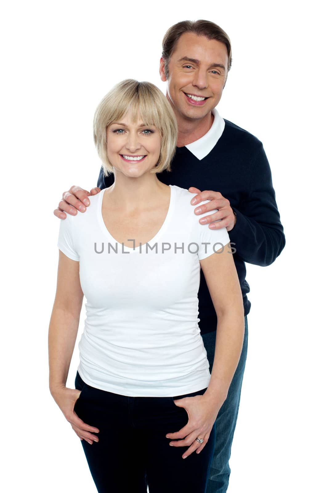 Portrait of trendy couple striking stylish pose by stockyimages