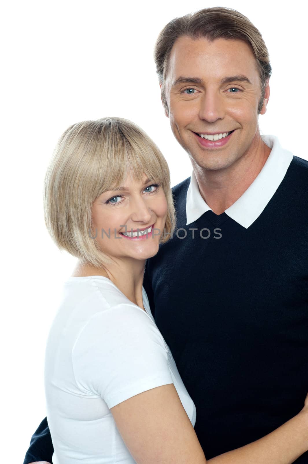 Adorable cheerful wife embracing her husband isolated on white background.