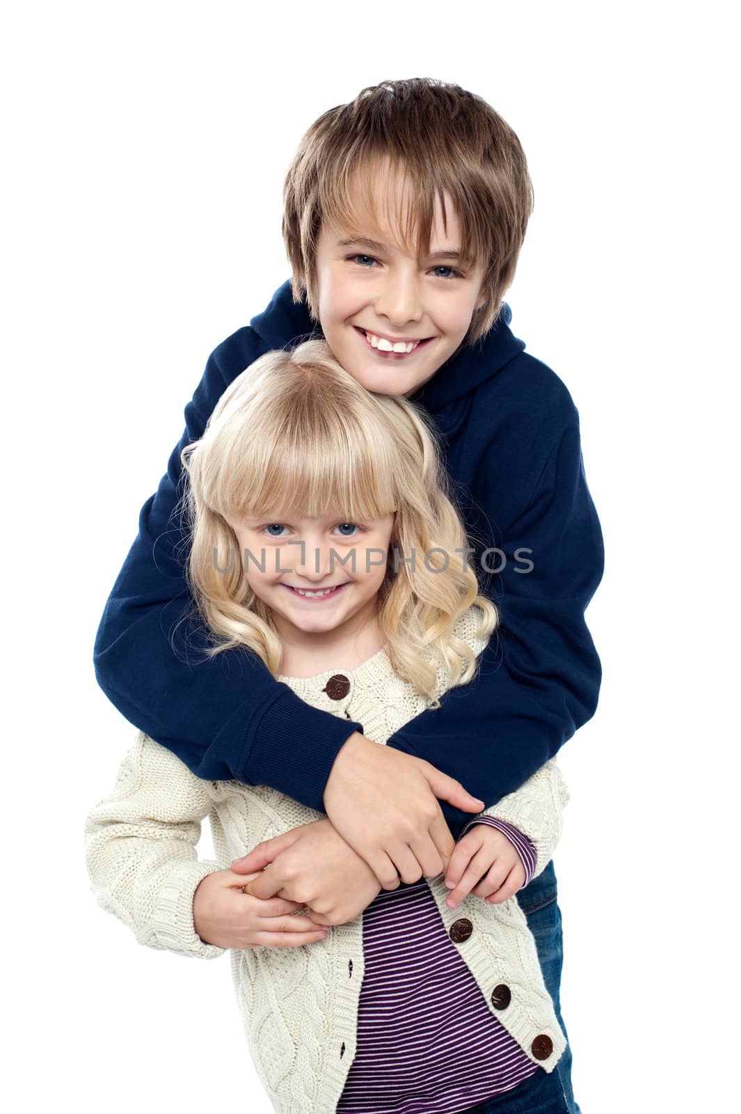 Affectionate siblings having fun together by stockyimages
