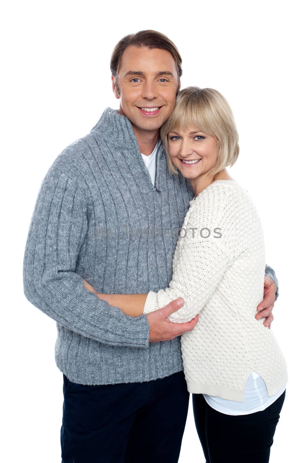 Fashionable woman hugging her loving husband by stockyimages