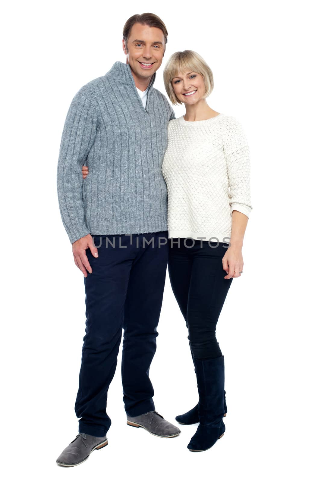 Charming middle aged dressed in casual winter wear isolated against white.