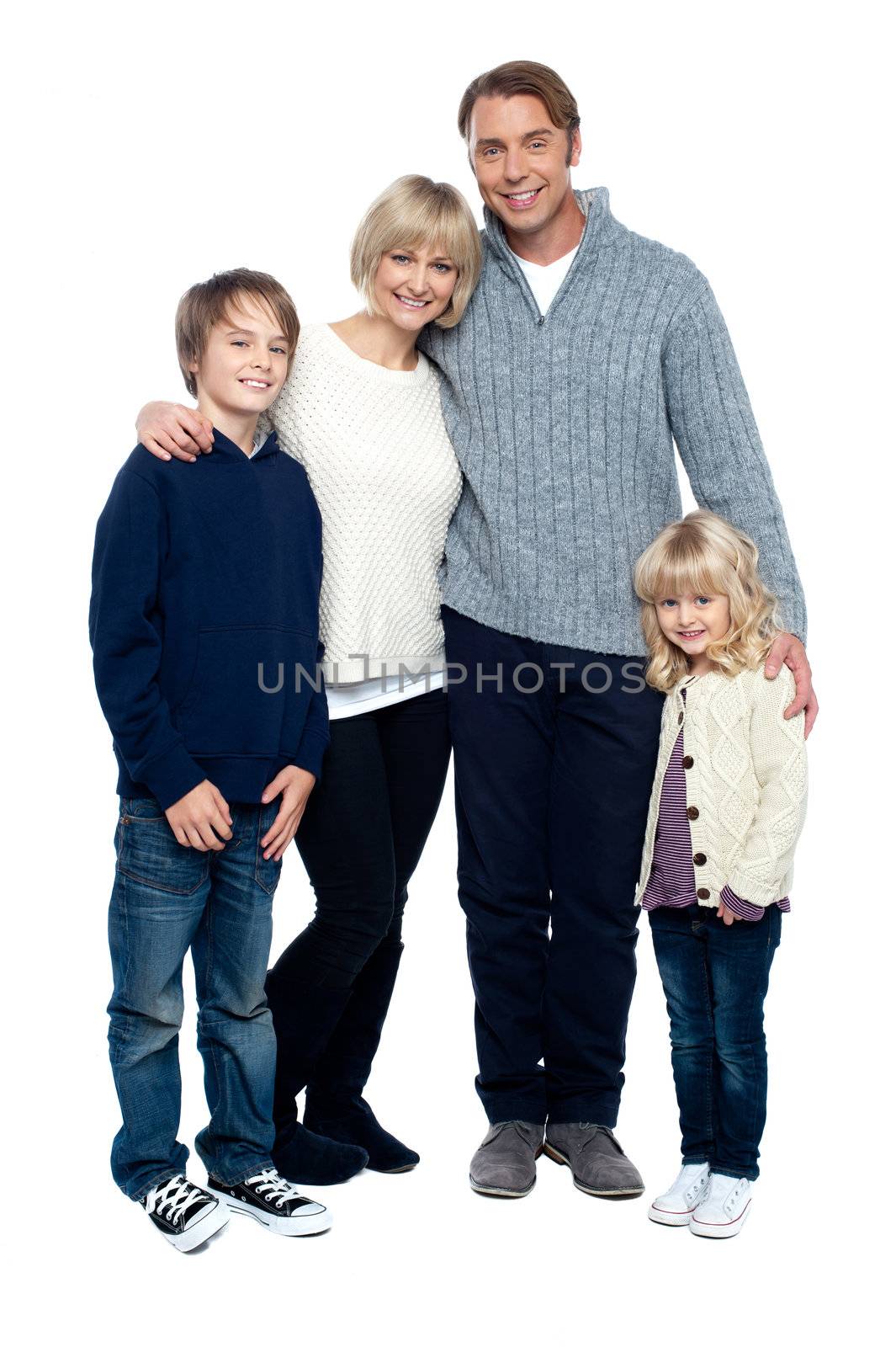 Affectionate family feeling the warmth of love, standing close to each other.