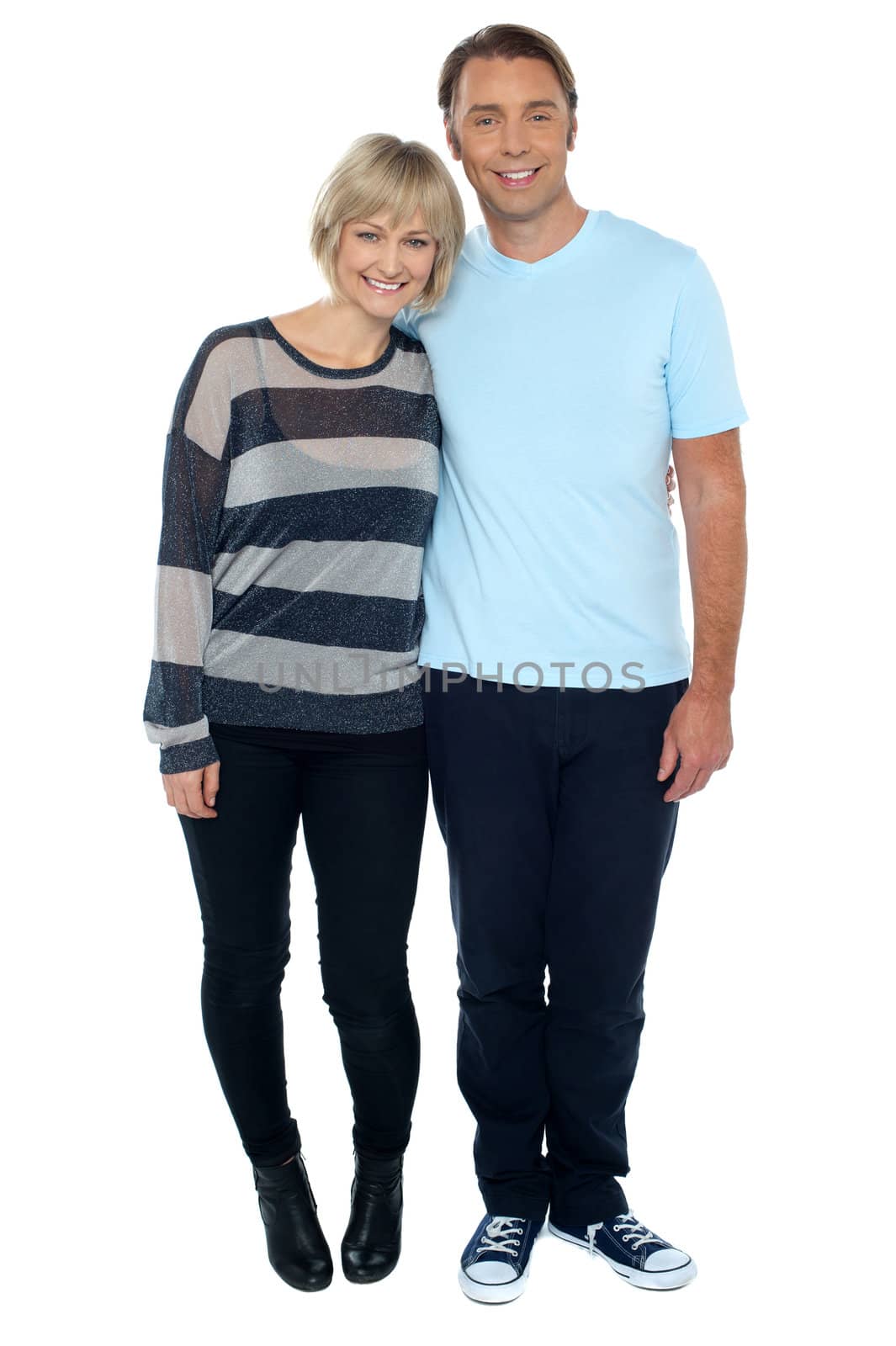 Attractive middle aged love couple. Full length studio shot on white background.