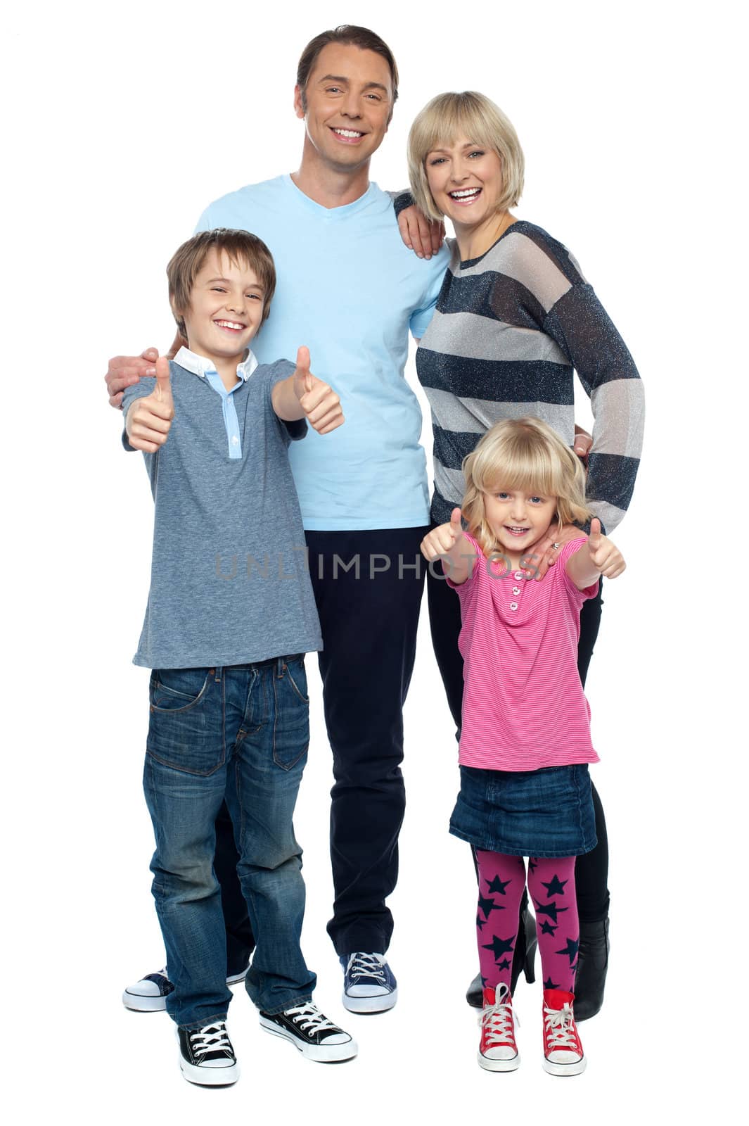 Snapshot of a successful family gesturing thumbs up by stockyimages