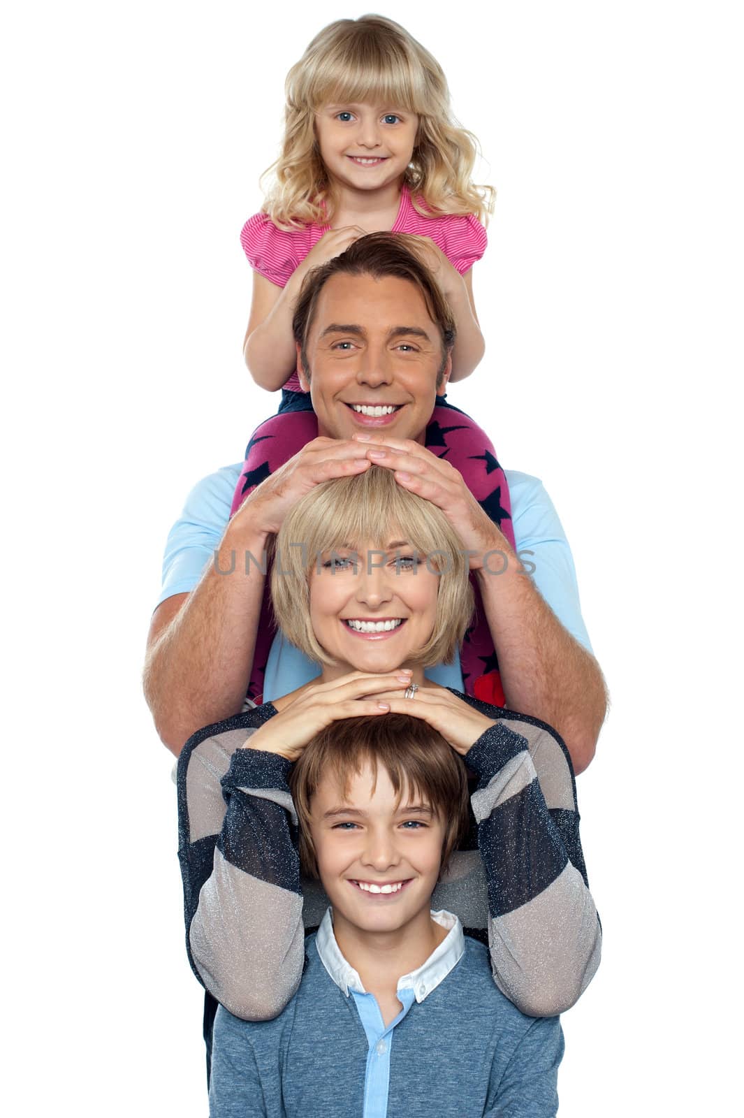 Attractive smiling family of four posing in a single line isolated over white background.