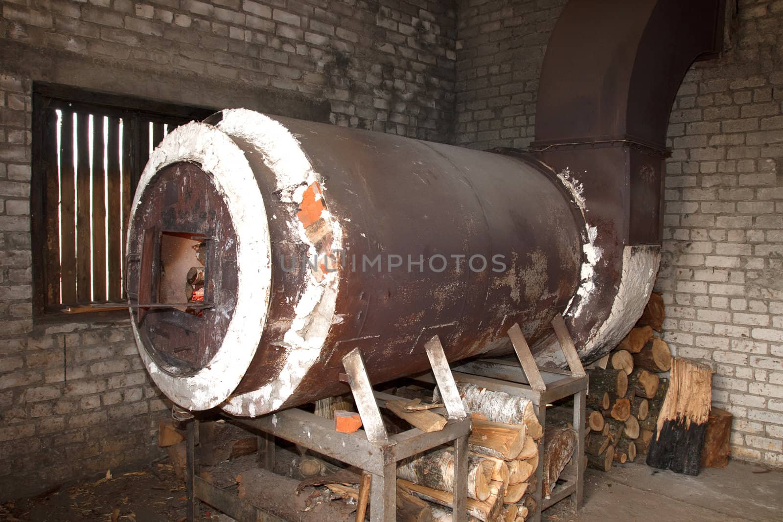 old rusty metal industrial oven heated with wood