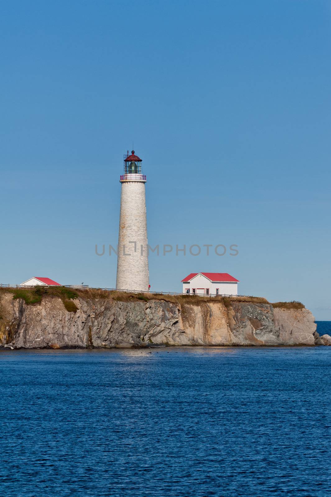 Cap des rosiers lighthouse during a cloudless day, Quebec, Canada