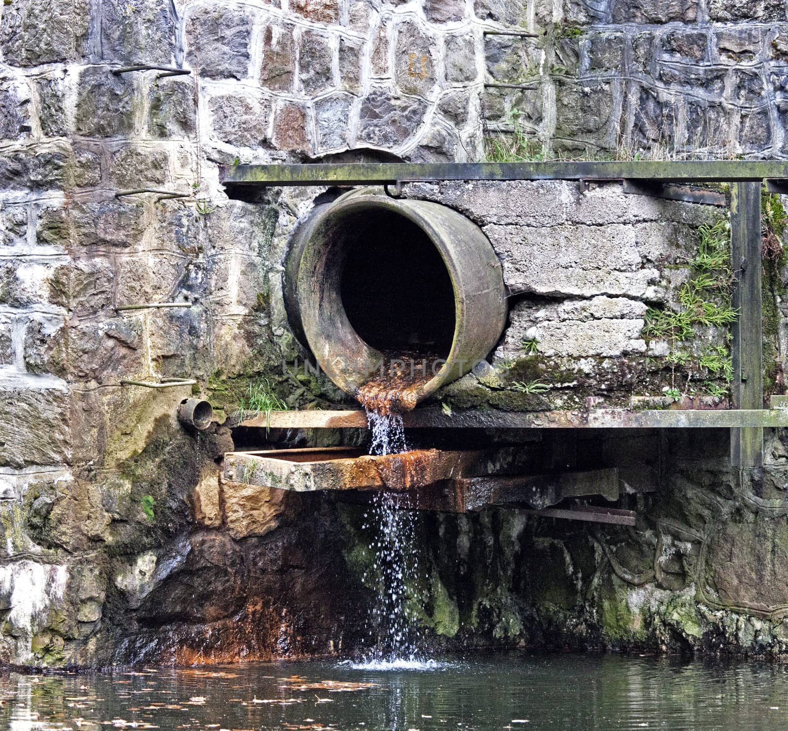 Sewage pipe on a dam