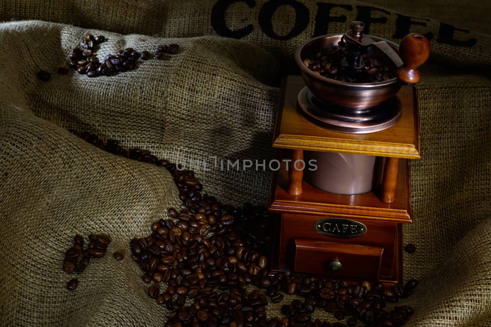 Coffee Mill with beans and burlap. still life