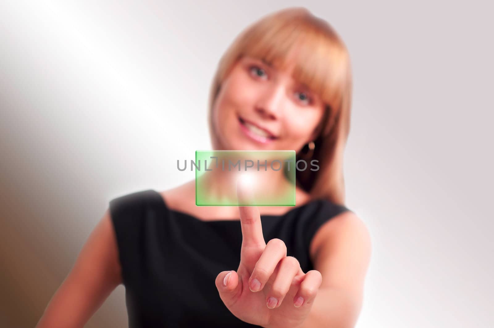 beautiful woman presses a button touch screen