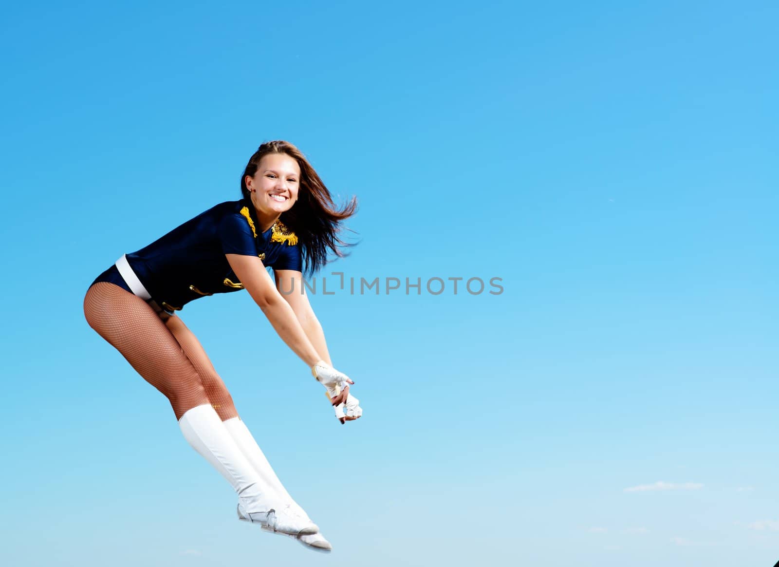 dancer jumping on a background of blue sky