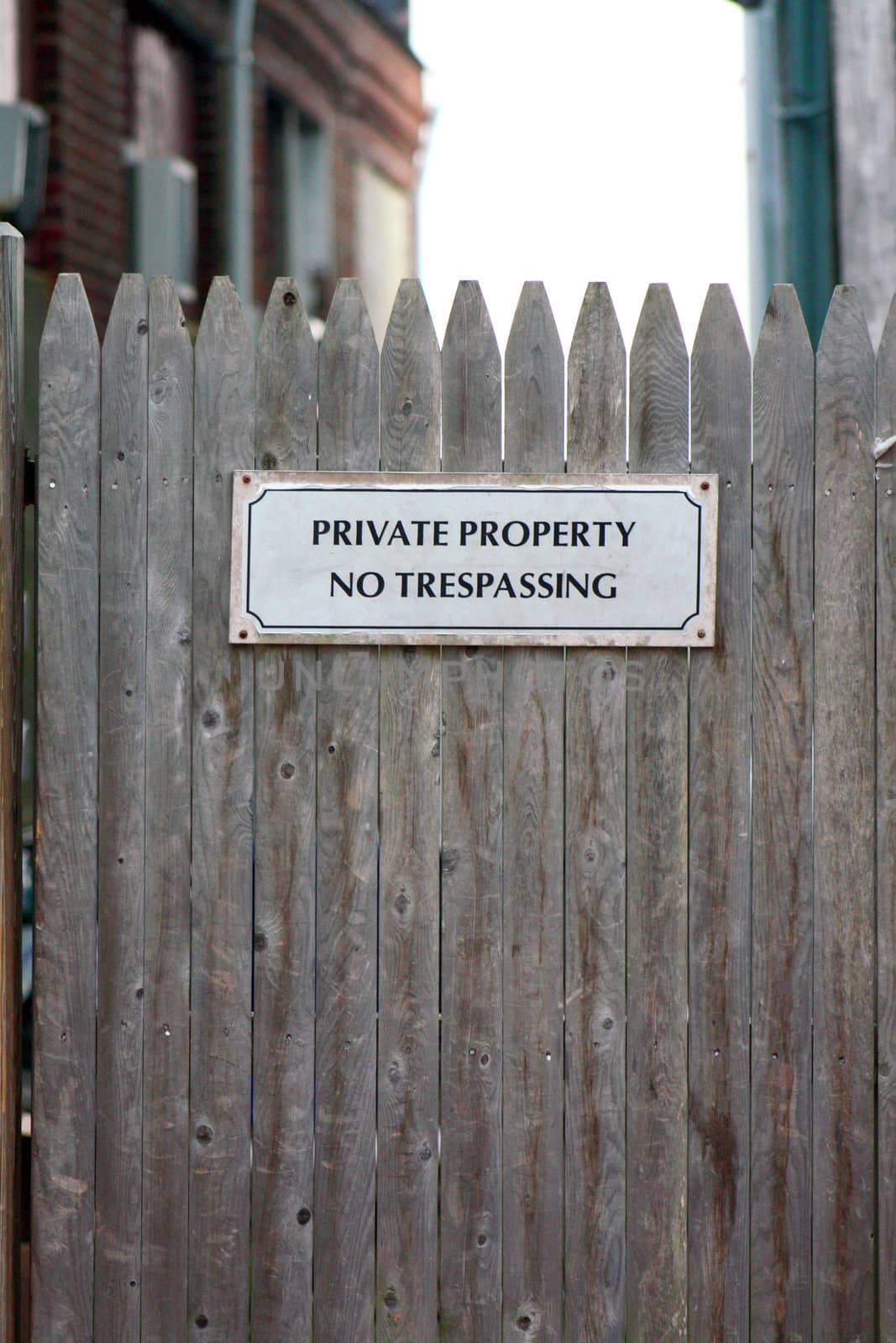 Private Property No Trepassing Sign on Wooden Fence