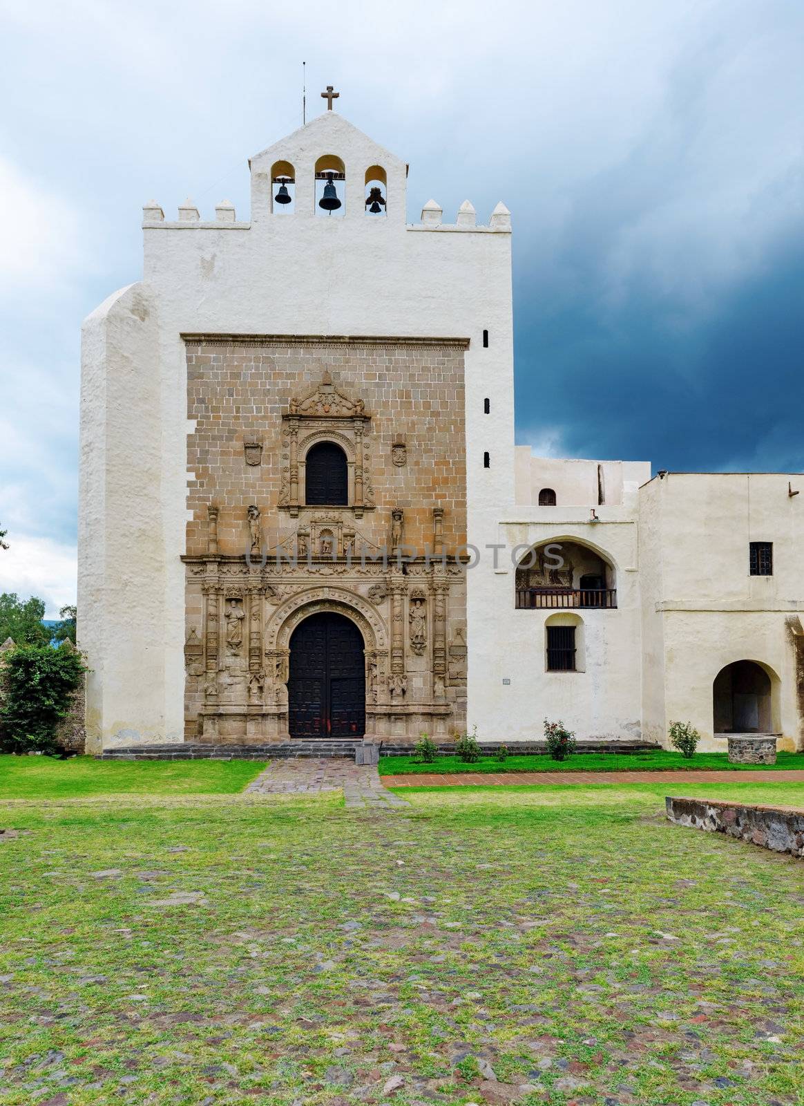  Monastery of San Augustin, declared a national monument in 1933, the monastery of San Agustín was built between 1539 and 1580 with most of the work being done after 1550. The walls are of rubble-stone construction and covered in plaster, topped by battlements, and the overall appearance is that of fortress. The crown of battlements, the single bell tower, the open chapel and the Plateresque facade identify the complex as a classic 16th century religious construction. The fortress appearance of complexes of this time were not literally for protection but rather served to dominate the landscape much as mediaeval castles in Europe did. In areas where there are carefully fitted stones, these stones have been carved. The construction of the monastery is attributed to Andrés de Olmos. Restoration work has been done in this complex since the 1920s, which has revealed all of the church’s facade and the atrium is terraced down to its original level of construction. This has exposed the flood damage from the colonial period. Most of the murals and frescos had been buried under years of plaster and paints before being restored