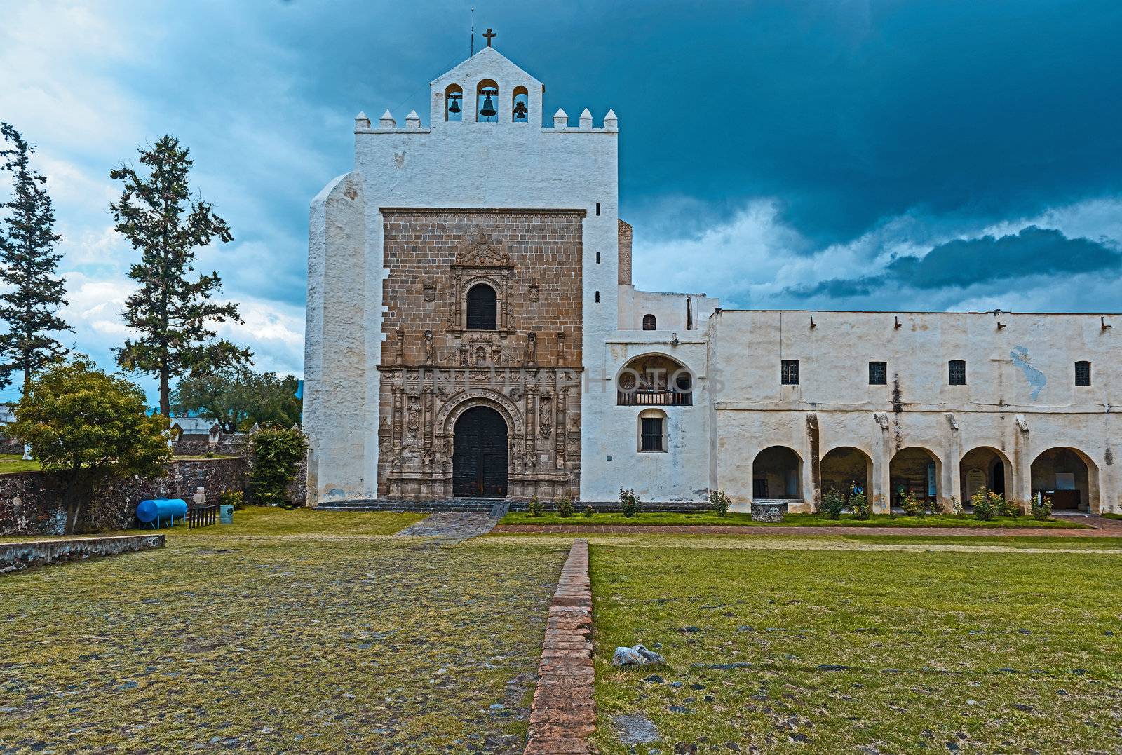  Monastery of San Augustin, declared a national monument in 1933, the monastery of San Agustín was built between 1539 and 1580 with most of the work being done after 1550. The walls are of rubble-stone construction and covered in plaster, topped by battlements, and the overall appearance is that of fortress. The crown of battlements, the single bell tower, the open chapel and the Plateresque facade identify the complex as a classic 16th century religious construction. The fortress appearance of complexes of this time were not literally for protection but rather served to dominate the landscape much as mediaeval castles in Europe did. In areas where there are carefully fitted stones, these stones have been carved. The construction of the monastery is attributed to Andrés de Olmos. Restoration work has been done in this complex since the 1920s, which has revealed all of the church’s facade and the atrium is terraced down to its original level of construction. This has exposed the flood damage from the colonial period. Most of the murals and frescos had been buried under years of plaster and paints before being restored