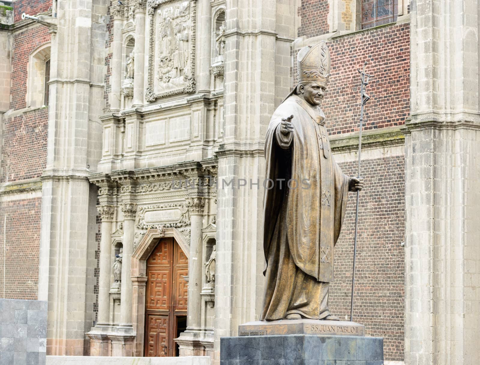 Bronze statue of Pope John Paul monument beside Old basilica in  by Marcus