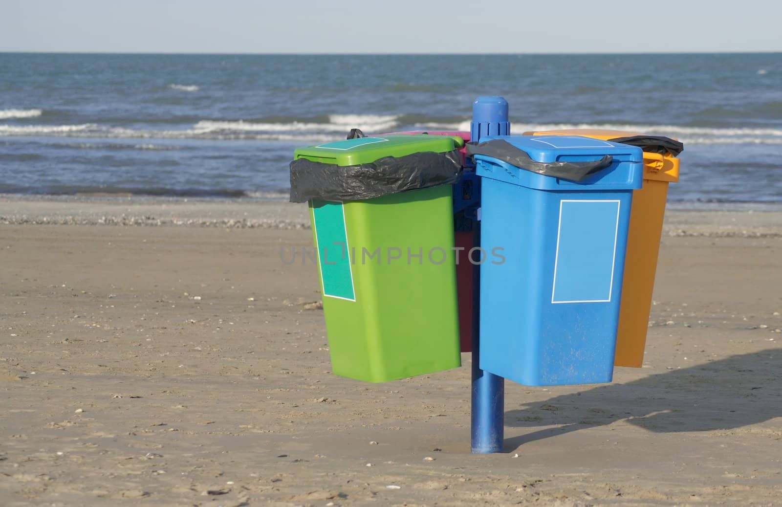 Garbage cans on the beach in Cervia in Italy