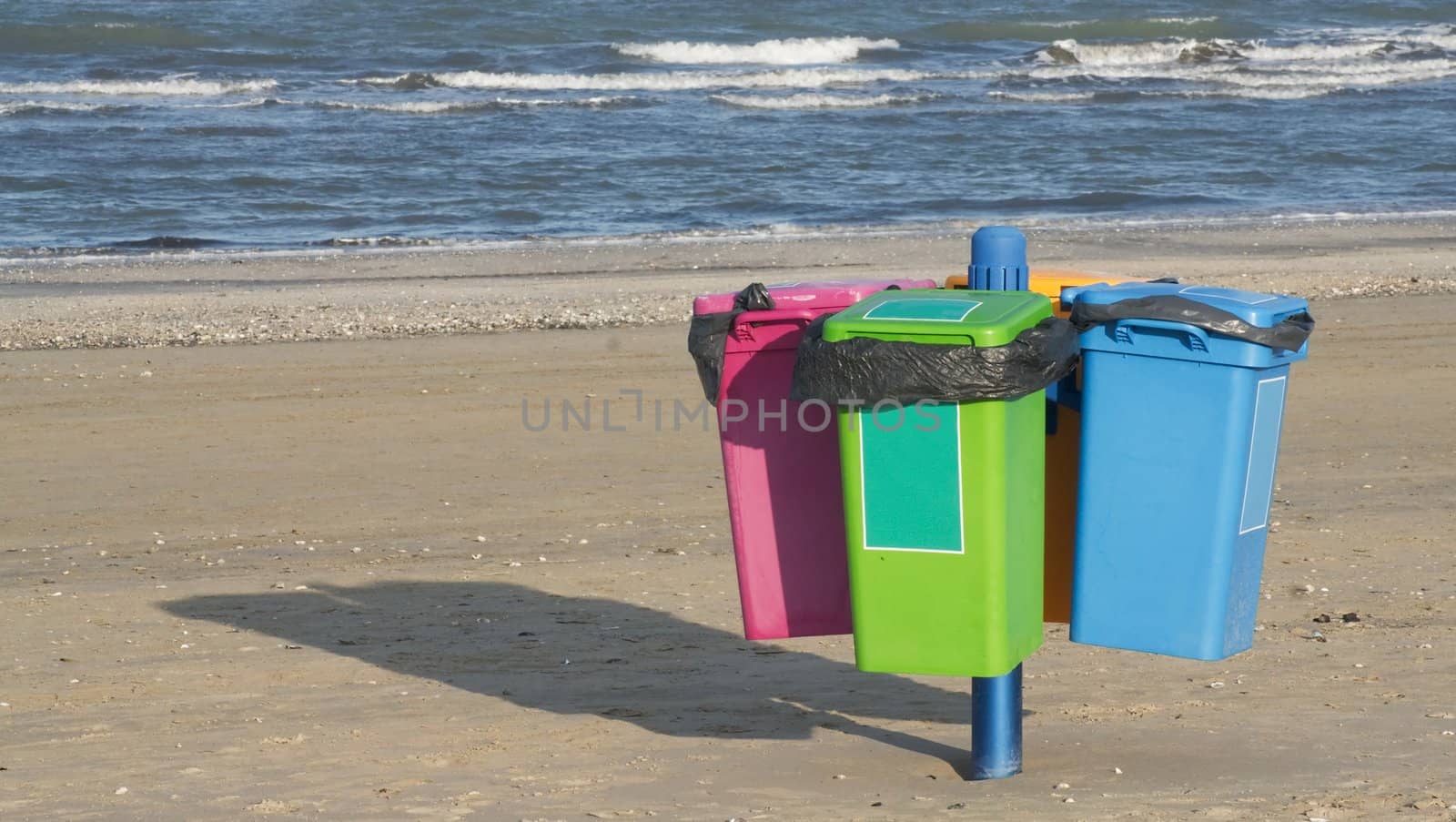 Garbage cans on the beach in Cervia in Italy