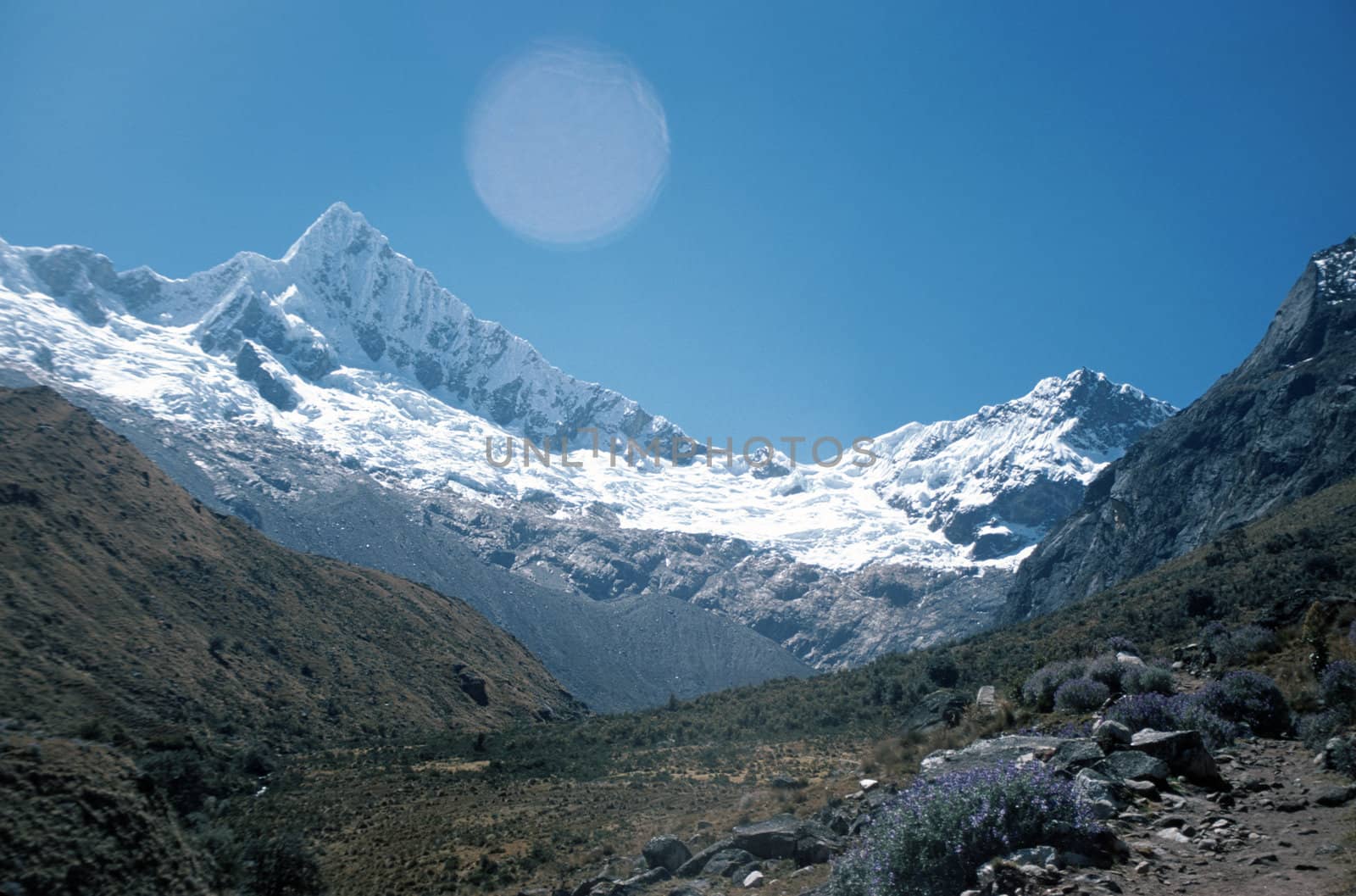 Beautiful snow capped Andes Mountains peak in Peru rising above