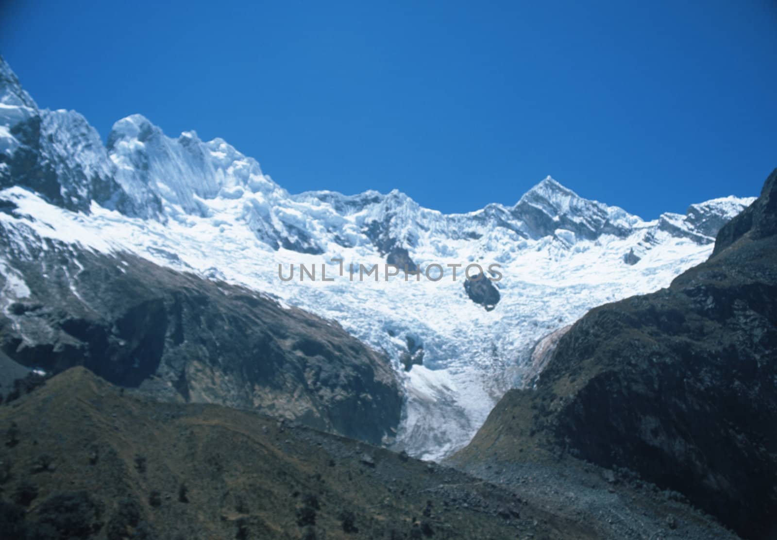 Stunning view of towering snow capped mountains in Peruvian Andes