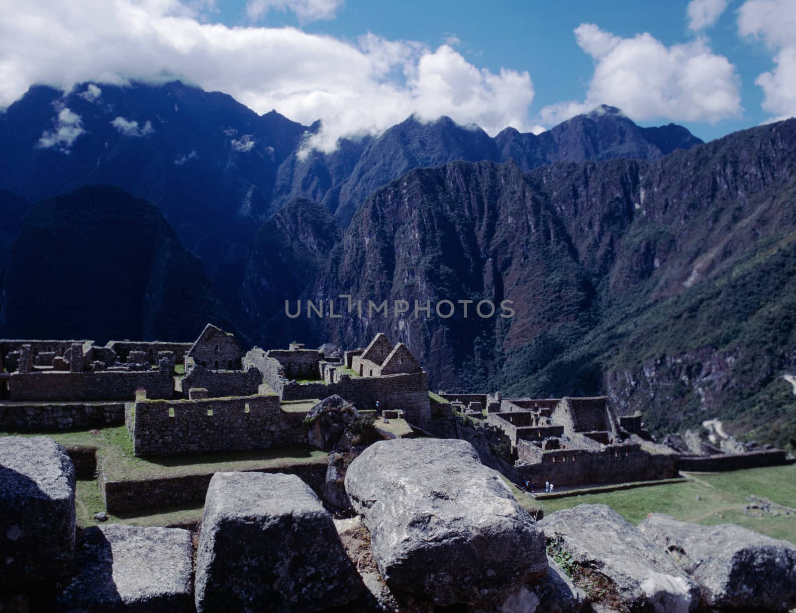 Beautiful historic ruins of Machu Picchu with Andes Mountains in background