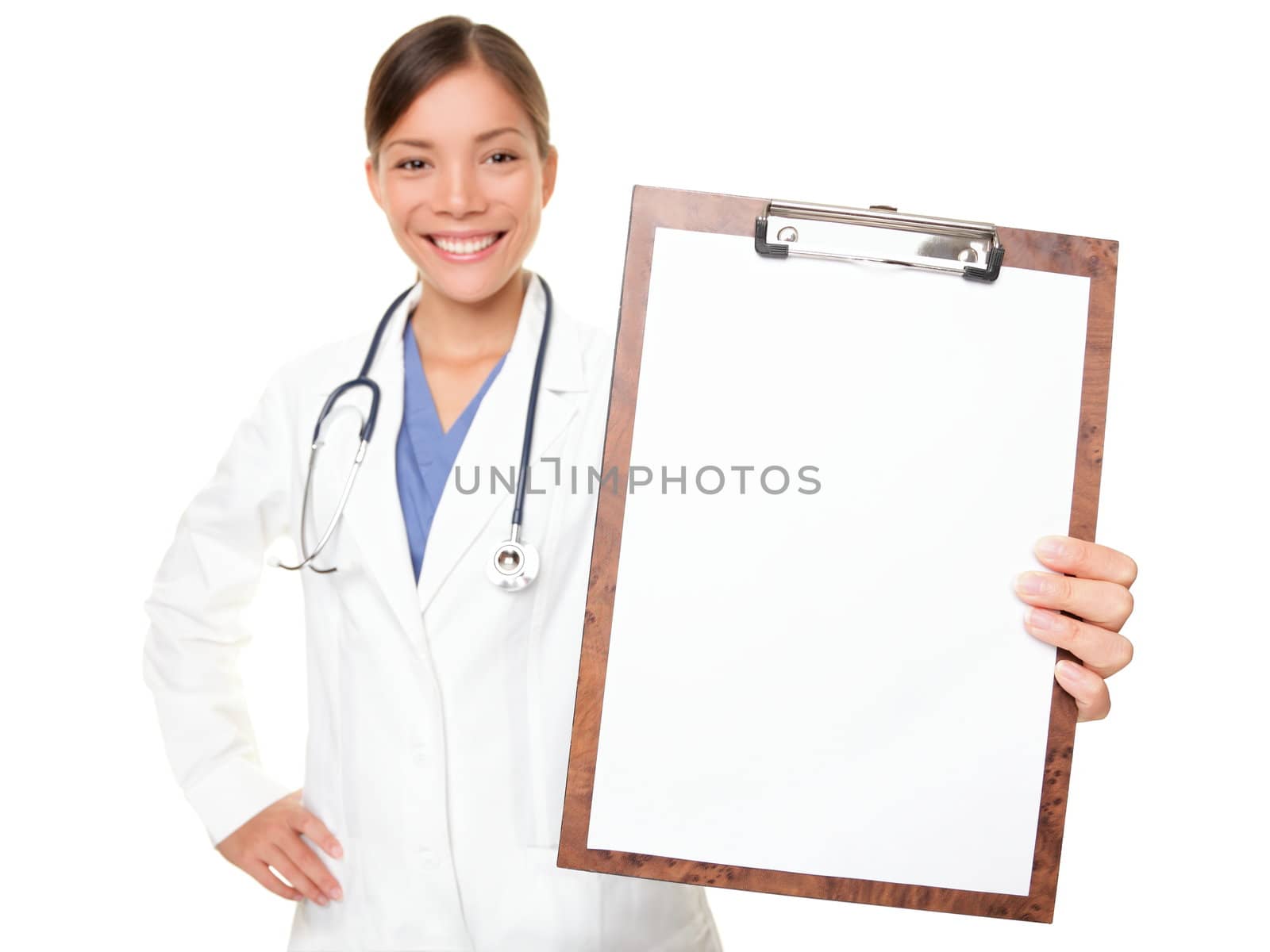 Medical sign - doctor showing clipboard with copy space for text or design. Woman doctor / nurse smiling happy isolated on white background. Mixed race Caucasian / Chinese Asian female model.