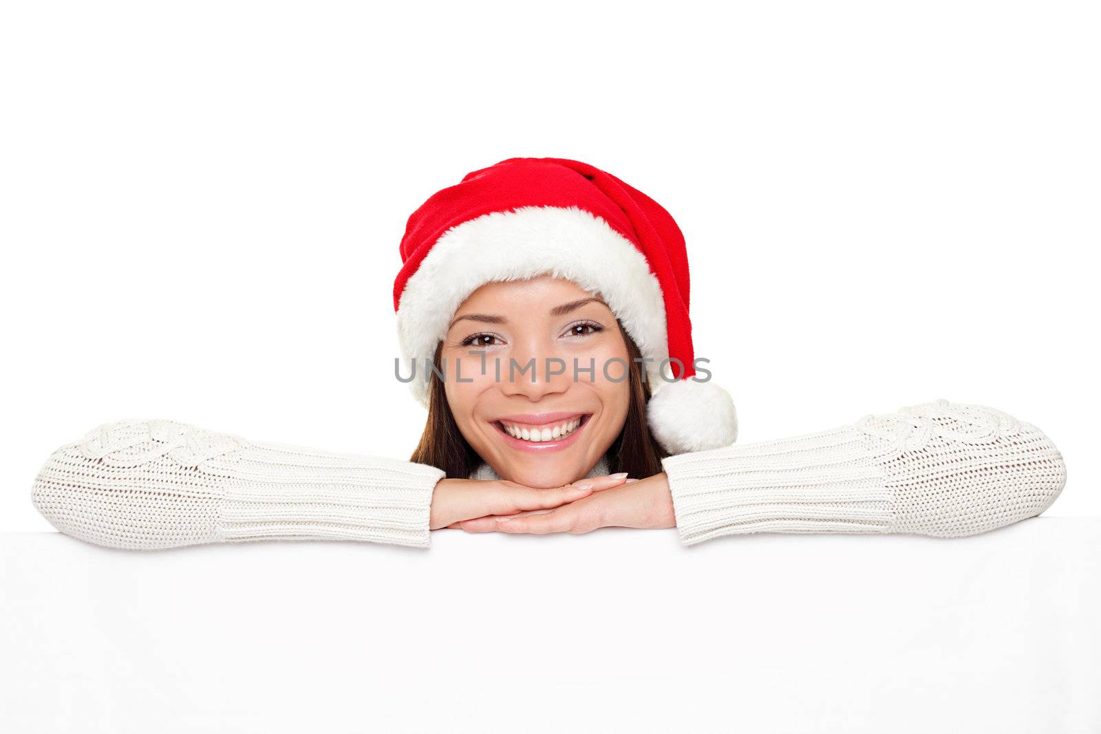 Christmas sign - Santa woman showing blank billboard banner sign smiling happy looking at camera. Beautiful cute mixed race Asian Caucasian female model.