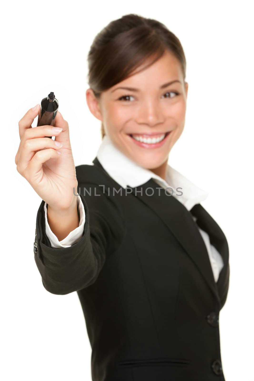 Business woman writing with black marker pen on virtual screen. Young professional smiling wearing suit. Chinese Asian / Caucasian businesswoman isolated on white background.