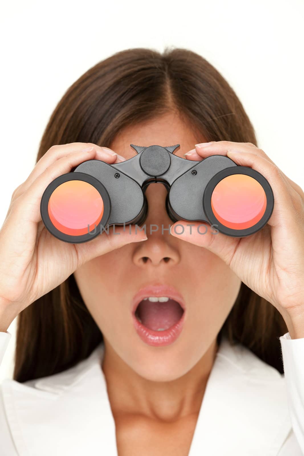 Binoculars woman looking surprised at camera - closeup of business woman in white suit looking.